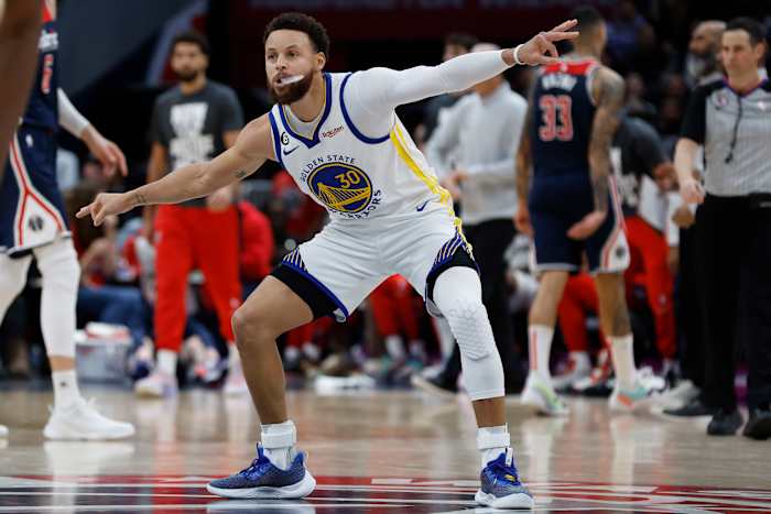 Golden State Warriors guard Stephen Curry (30) gestures at Warriors guard Jordan Poole (not pictured) after a three point field goal against the Washington Wizards in the final minute of the fourth quarter at Capital One Arena.